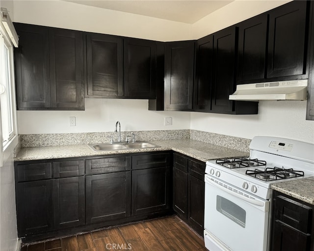 kitchen featuring sink, dark wood-type flooring, and white gas stove