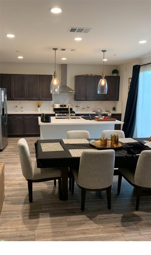 dining room featuring light hardwood / wood-style floors and sink