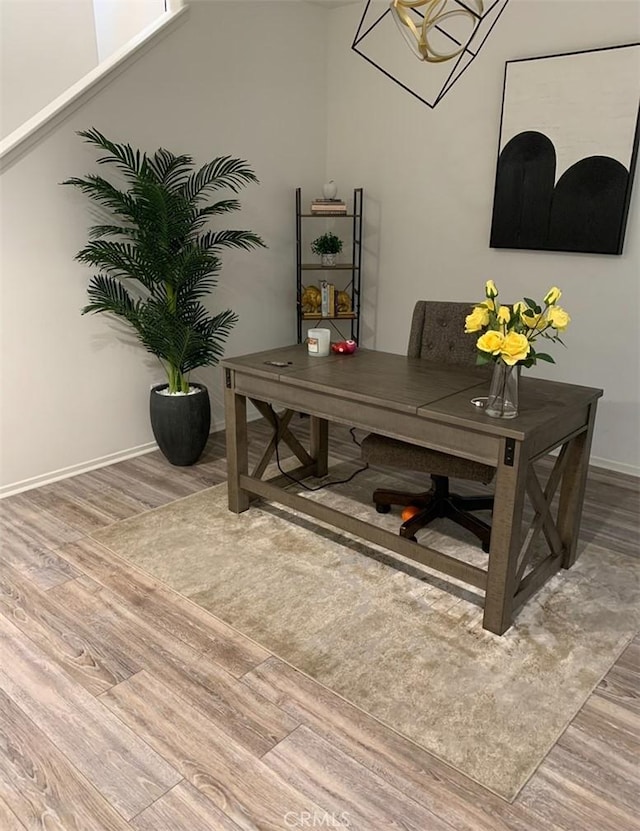 home office with hardwood / wood-style flooring