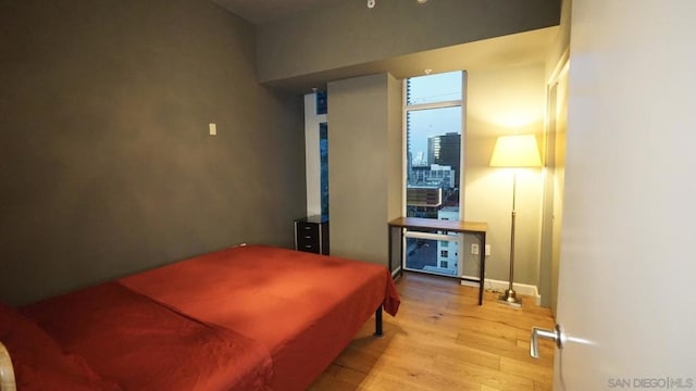 bedroom with light wood-type flooring