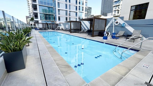 view of swimming pool with a patio area