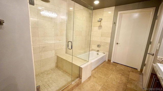 bathroom featuring separate shower and tub and vanity