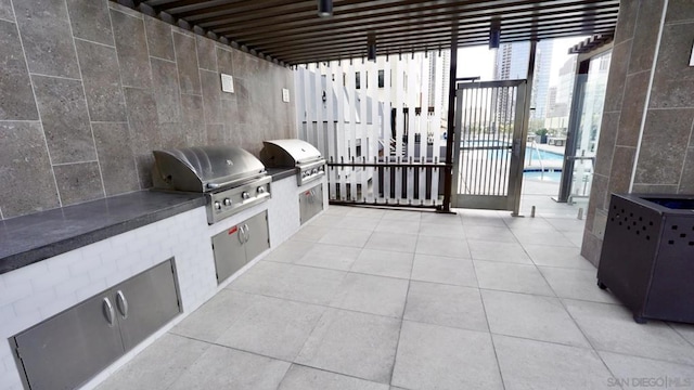 view of patio / terrace with an outdoor kitchen and grilling area