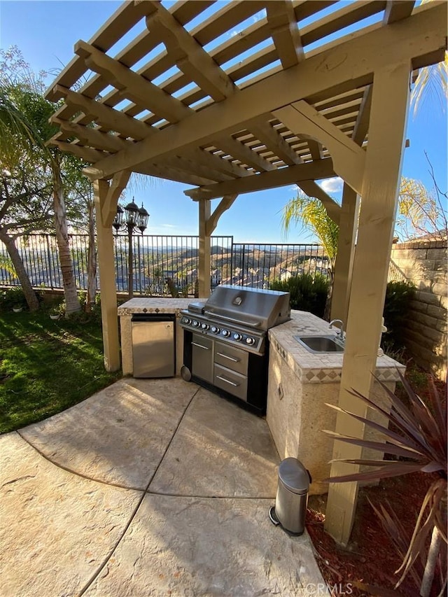 29161 Garnet Canyon Dr, Saugus, CA 91390 - view of patio / terrace featuring fence, a pergola, a sink, and exterior kitchen