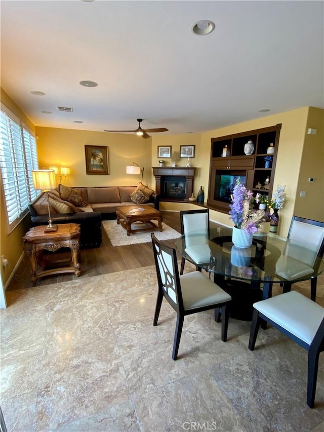 29161 Garnet Canyon Dr, Saugus, CA 91390 - dining area featuring wood finished floors, baseboards, a ceiling fan, and visible vents