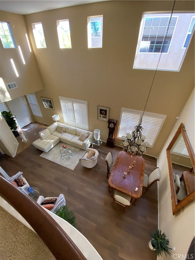 29161 Garnet Canyon Dr, Saugus, CA 91390 - living area with a high ceiling, wood finished floors, visible vents, and plenty of natural light