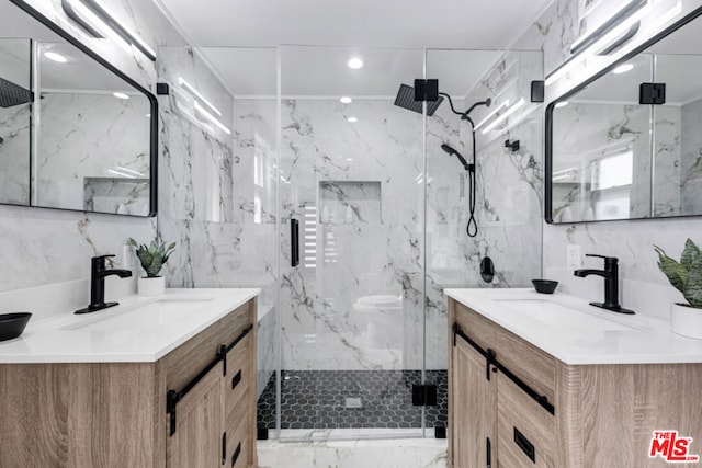 bathroom with vanity, tile walls, and walk in shower