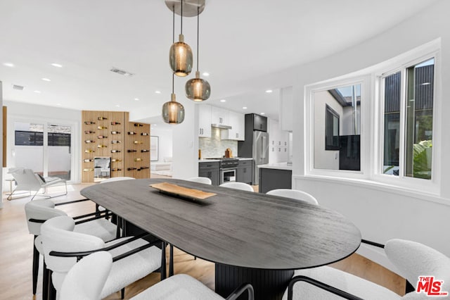 dining area with light hardwood / wood-style flooring