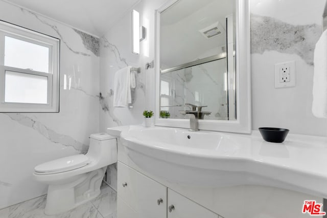 bathroom with vanity, toilet, and walk in shower