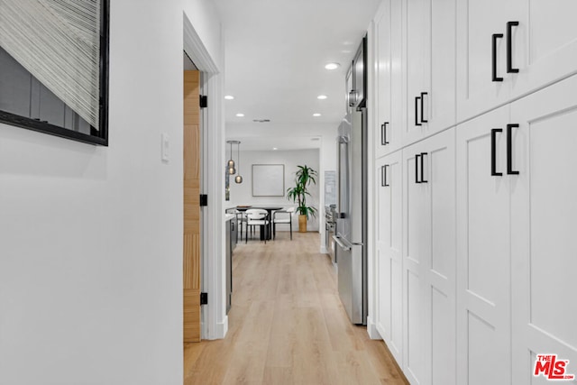 hallway featuring light hardwood / wood-style flooring