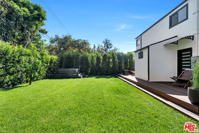 view of yard with a wooden deck