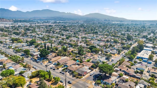 birds eye view of property with a mountain view