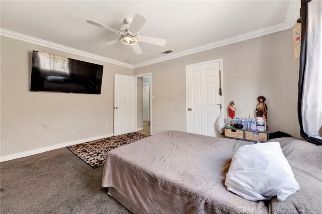 carpeted bedroom with ceiling fan and ornamental molding