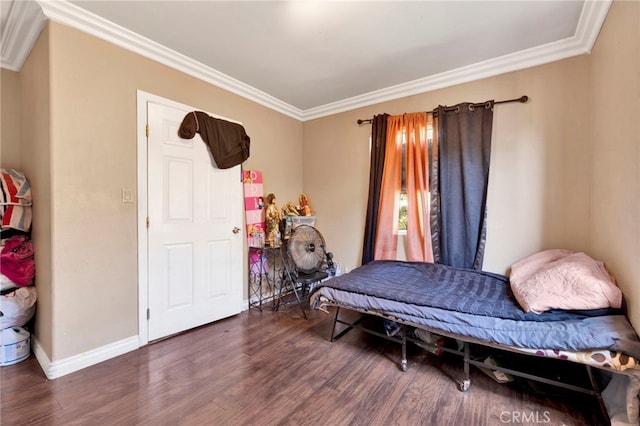 bedroom featuring dark hardwood / wood-style flooring and ornamental molding