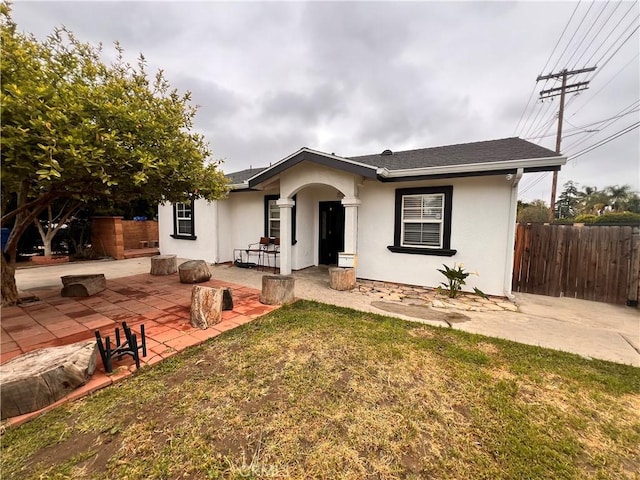 13286 Terra Bella St, Pacoima, CA 91331 - view of front of house with a patio, stucco siding, and fence