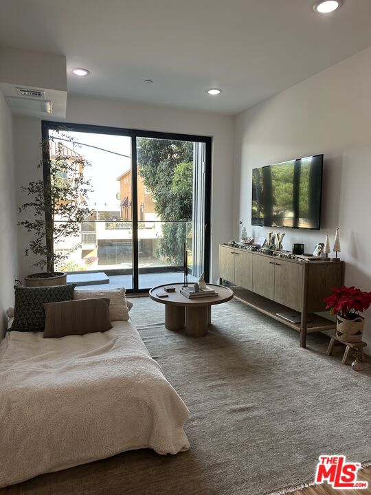 carpeted bedroom featuring access to outside