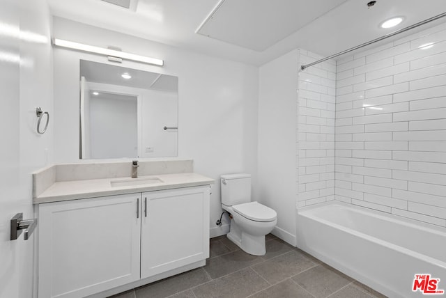 full bathroom featuring tile patterned floors, toilet, vanity, and tiled shower / bath