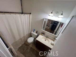 bathroom with vanity, toilet, tile patterned floors, and a shower with curtain