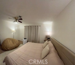 bedroom featuring ceiling fan and carpet floors