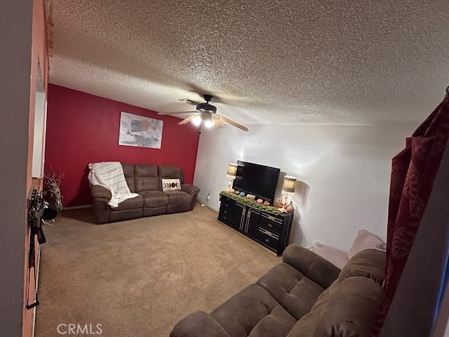 carpeted living room featuring a textured ceiling and ceiling fan