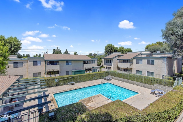 view of swimming pool featuring a patio area and grilling area