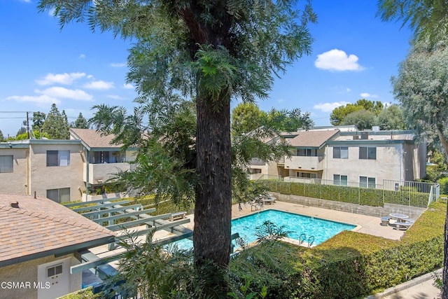 view of swimming pool with a patio