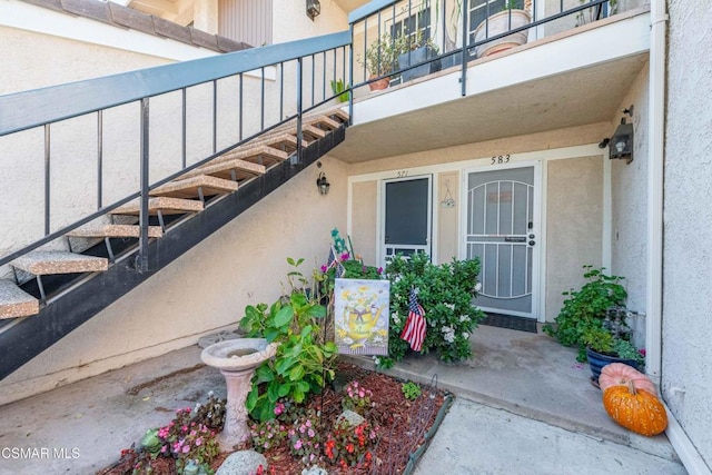 property entrance with a balcony