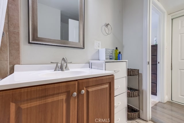 bathroom with vanity and hardwood / wood-style flooring