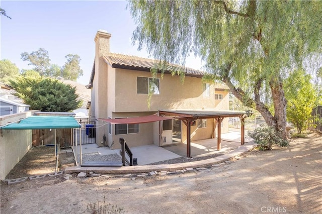 rear view of house featuring a patio area