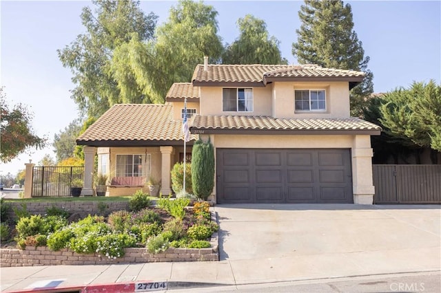 mediterranean / spanish house featuring a garage