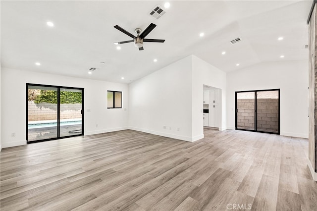 unfurnished living room with lofted ceiling, light wood-type flooring, and ceiling fan