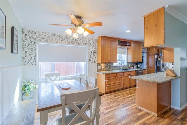 kitchen featuring sink, a healthy amount of sunlight, and light wood-type flooring