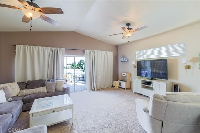 carpeted living room with vaulted ceiling and ceiling fan