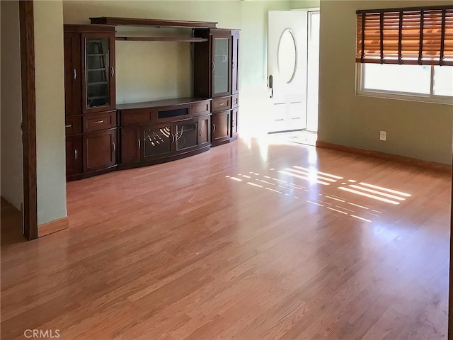 unfurnished living room featuring light hardwood / wood-style flooring