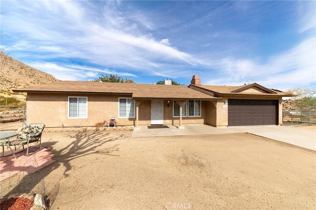 single story home featuring a garage