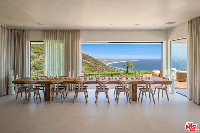 dining space with a water view