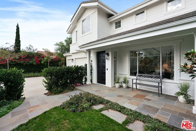 doorway to property with covered porch