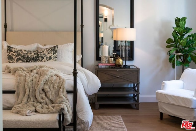 bedroom with wood-type flooring