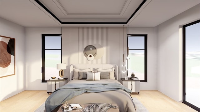 bedroom with a tray ceiling, multiple windows, and access to exterior