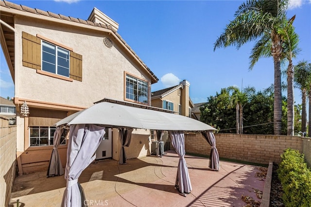 rear view of property with a patio area