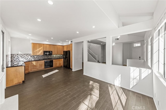 kitchen with lofted ceiling, decorative backsplash, dark hardwood / wood-style flooring, black appliances, and sink