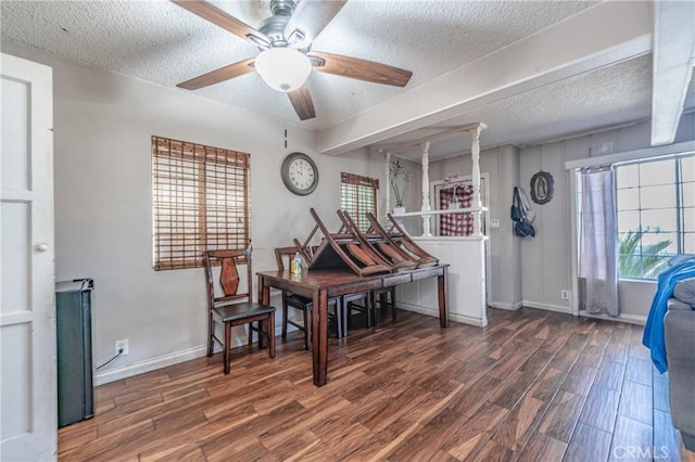 miscellaneous room featuring ceiling fan, dark hardwood / wood-style floors, and a textured ceiling