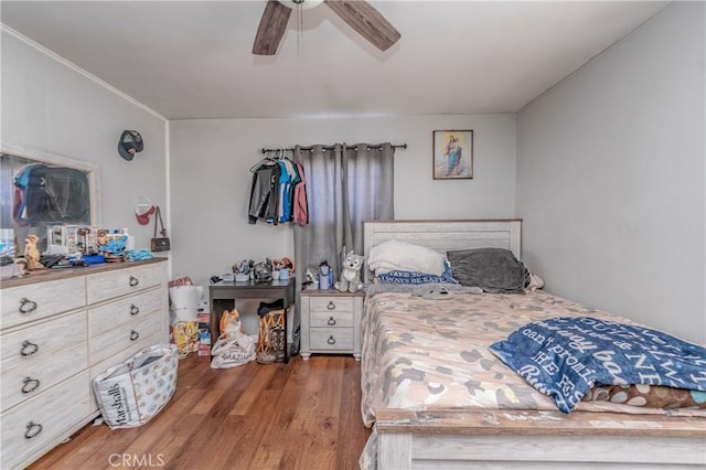 bedroom with ceiling fan and hardwood / wood-style floors