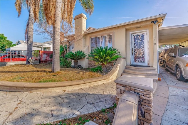 view of front of home featuring a carport