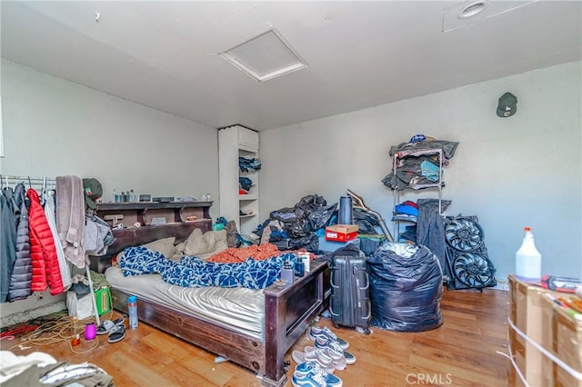 bedroom with hardwood / wood-style floors