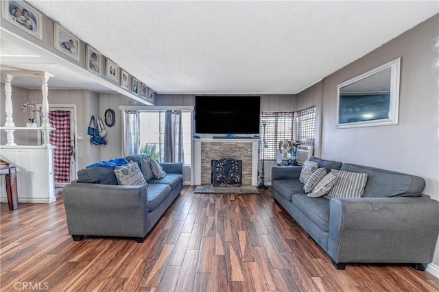 living room featuring a fireplace and a textured ceiling