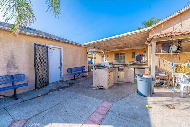 view of patio featuring exterior kitchen and area for grilling