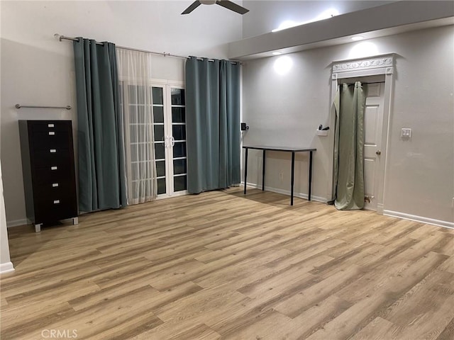 empty room with ceiling fan and light wood-type flooring