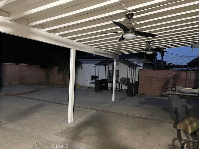 view of patio featuring ceiling fan