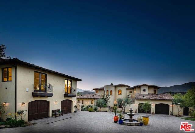 mediterranean / spanish home featuring a mountain view and a balcony